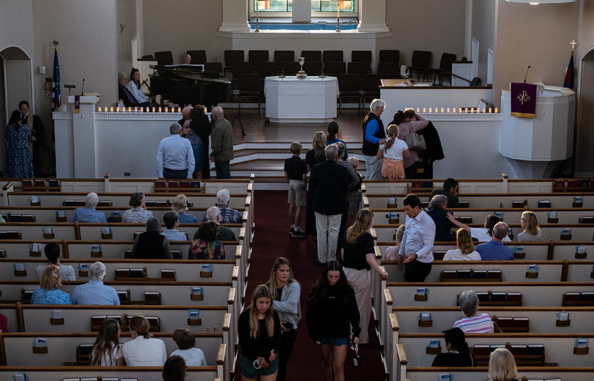 People attend a vigil at Woodmont Christian for those who were killed in a mass shooting at The Covenant School on March 27, 2023, in Nashville, Tennessee. According to initial reports, three students and three adults were killed by the shooter, a 28-year-old woman who self-identified as trans. The shooter was killed by police responding to the scene.