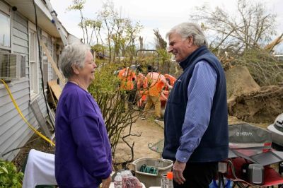 Franklin Graham meets with homeowner Liz Estes following a deadly tornado in Rolling Fork, Mississippi on March 29, 2023.