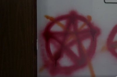 Spray-painted vandalism at Konnarock Baptist Church of Washington County, Virginia, which occurred sometime on Easter weekend, 2023.
