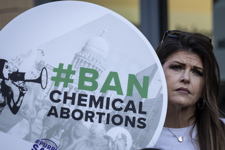 Anti-abortion activists protest against the availability of abortion pills at neighborhood pharmacies outside of a CVS Pharmacy on January 18, 2023, in Washington, D.C., Earlier in February, the Food and Drug Administration (FDA) made a regulatory change that now allows retail pharmacies to offer abortion pills to people who have a prescription.
