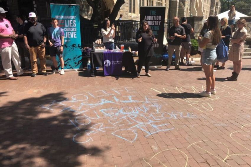 Students for Life of America President Kristan Hawkins talks with pro-choice students at Georgetown University on Thursday, April 20, 2023. 