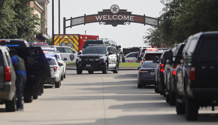 Emergency vehicles line the entrance to the Allen Premium Outlets where a shooting took place on May 6, 2023, in Allen, Texas. According to reports, a shooter opened fire at the outlet mall, injuring at least nine people who were taken to local hospitals. The police have confirmed there were fatalities but have not specified how many. The unidentified shooter was neutralized by an Allen Police officer responding to an unrelated call.