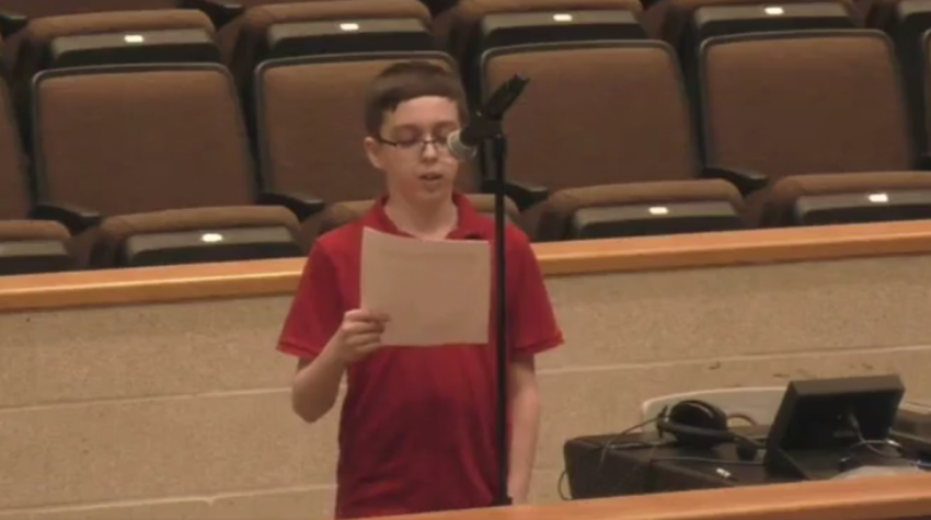 Middleborough Public Schools student Liam Morrison, 12, addresses the school committee after he was sent home for declining to change out of a shirt reading "there are only two genders," April 13, 2023. 