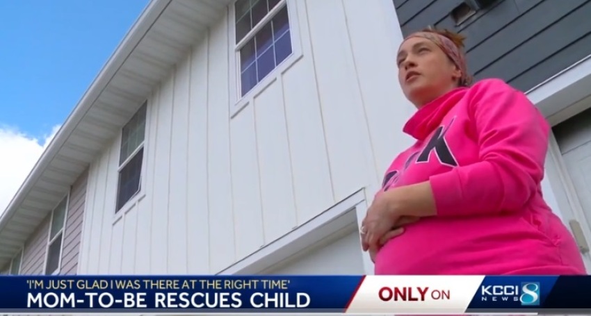 Kyrie Jones, 35, stands outside her town home while being interviewed by KCCI in Des Moines, Iowa, in May 2023.
