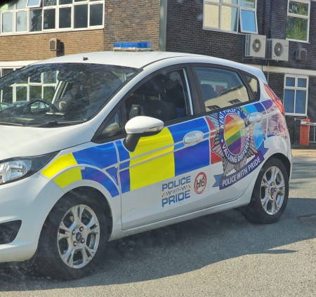 A British police cruiser decorated to show solidarity with LGBT pride.
