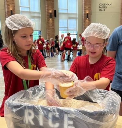 Children at First United Methodist Church Richardson in Texas participate in a Rise Against Hunger event held June 14, 2023.