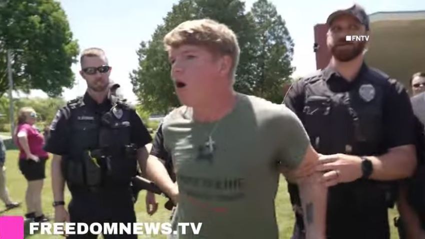 An unidentified Christian protester was detained by police at the pride event in Watertown.