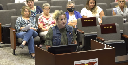 Suffolk resident Angela Kilgore addresses the school board during a public meeting on August 10, 2023.