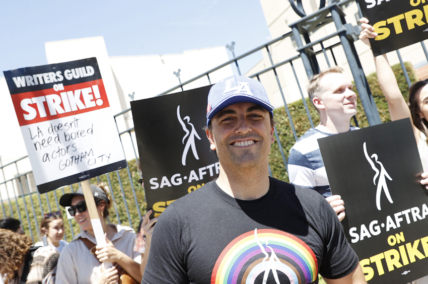 Mayor of Burbank, Konstantine Anthony, walks a picket line alongside members of the Writers Guild of America and the Screen Actors Guild outside Disney Studios in Burbank, California, on July 14, 2023. Tens of thousands of Hollywood actors went on strike at midnight July 13, 2023, effectively bringing the giant movie and television business to a halt as they join writers in the first industry-wide walkout for 63 years.