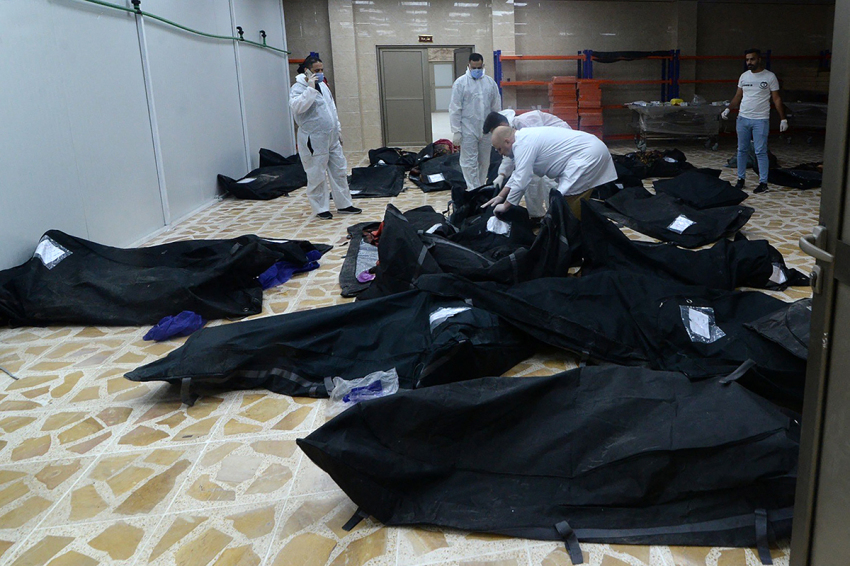 Bodies of people killed in a fire during a wedding in an event hall in Qaraqosh, also known as Hamdaniyah, are piled up at the morgue of a hospital in Mosul on September 27, 2023. At least 100 people were killed and more than 150 injured when the fire broke out.