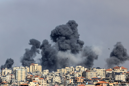 Smoke rises over Gaza City on October 7, 2023, during Israeli airstrikes. Palestinian militants have begun a