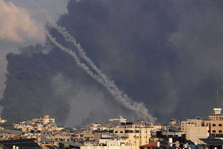 A salvo of rockets is fired by Palestinian militants from Gaza towards Israel on October 10, 2023. Israel said it recaptured Gaza border areas from Hamas as the war's death toll passed 3,000 on October 10, the fourth day of grueling fighting since the Islamists launched a surprise attack.