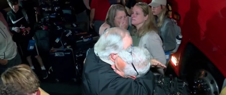 Members of Sunnyside Baptist Church of Kingsport, Tennessee, embrace each other as a tour group safely returns from Israel amid the October 2023 outbreak of war.