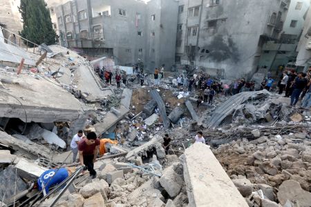 Palestinians search the destroyed annex of the Greek Orthodox Saint Porphyrius Church, the oldest church still in use in Gaza, damaged in a strike on Gaza City on October 20, 2023, amid the ongoing battles between Israel and the Palestinian group Hamas.