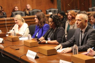 (Third from left) Tanya Gould, the director of the Anti-Human Trafficking Office of the Virginia Attorney General, shares her story during a congressional briefing in Washington, D.C., on Oct. 26, 2023.