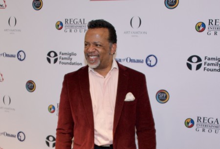 Bishop Carlton Pearson poses for photos at the premiere of the Netflix project "Come Sunday" in 2018.