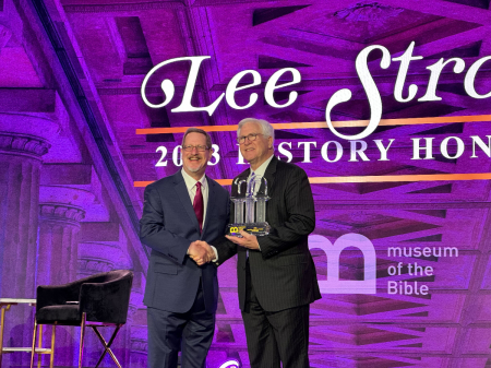 Lee Strobel (left) accepts the Pillar Award for history at the Museum of the Bible in Washington, D.C., November 11, 2023.