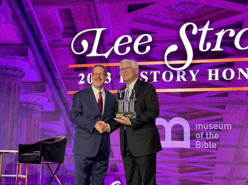Lee Strobel (left) accepts the Pillar Award for history at the Museum of the Bible in Washington, D.C., November 11, 2023.