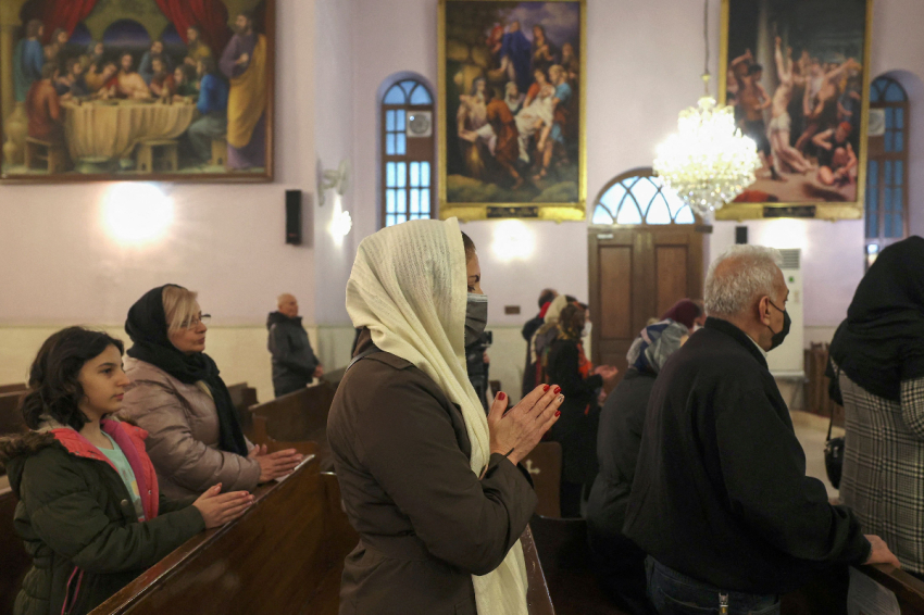 Iranian Christians attend the New Year mass at the Saint Targmanchats Armenian Church in Tehran on January 1, 2023.