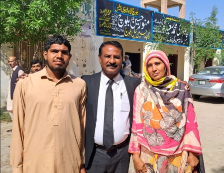 Musarrat Bibi (right) is pictured with attorney Lazar Allah Rakha (center) and Muhammad Sarmad (left) after their acquittal in Pakistan.