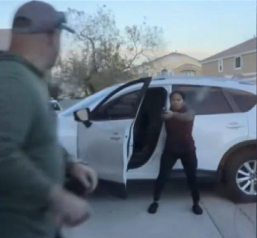 The moment Joe Junio (holding a gun), 36, fatally shot 46-year-old Nicholas Davi (L) and his wife, Sarah Davi, on December 29, 2023, in a condominium complex near Deer Springs and Aviary ways in North Las Vegas, Nevada.