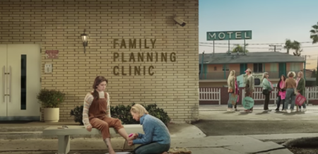 An ad from the 'He Gets Us' campaign titled 'Foot Washing,' which aired during Super Bowl LVIII, includes an image of an older woman washing the feet of a younger woman outside an abortion clinic.