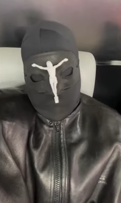 Kanye West wears an Alexander McQueen face mask to Super Bowl LVIII in Las Vegas, Nevada.