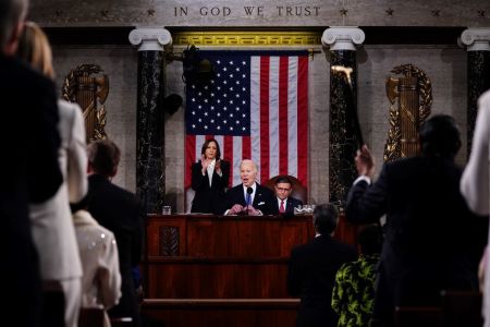 President Joe Biden delivers the annual State of the Union address before a joint session of Congress in the House chamber at the U.S. Capital building on March 7, 2024, in Washington, D.C. Seated to the right of Biden is Speaker of the House Mike Johnson. Vice President Kamala Harris stands to the left of Biden.