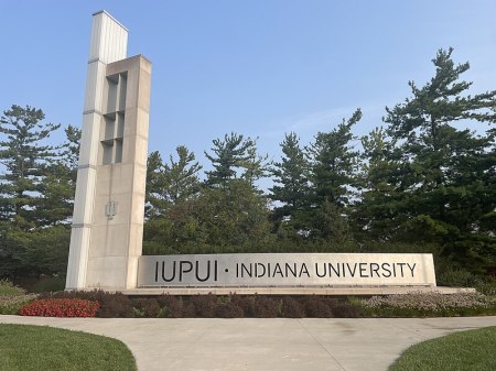 The entrance sign sits on the campus of Indiana University–Purdue University Indianapolis in July 2023.