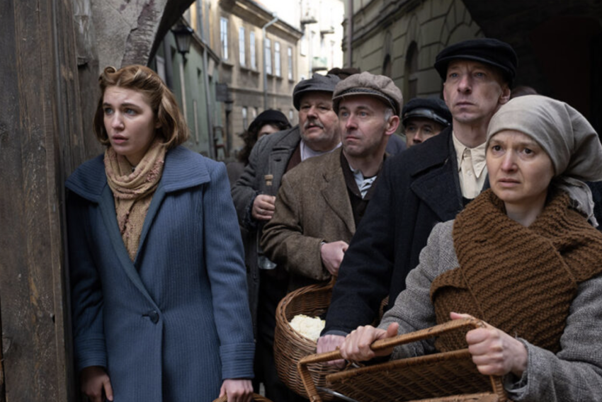 Sophie Nélisse as Irene Gut Opdyke, left, stars in a scene from the movie “Irena's Vow.”