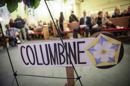 Signage for Columbine High School during a 25th Year Remembrance ceremony on April 19, 2024, at First Baptist Church of Denver in Denver, Colorado. Twelve students and one teacher were shot and killed and many more injured on April 20, 1999, at Columbine High School in Littleton, Colorado, in a school shooting that shocked the country at the time.