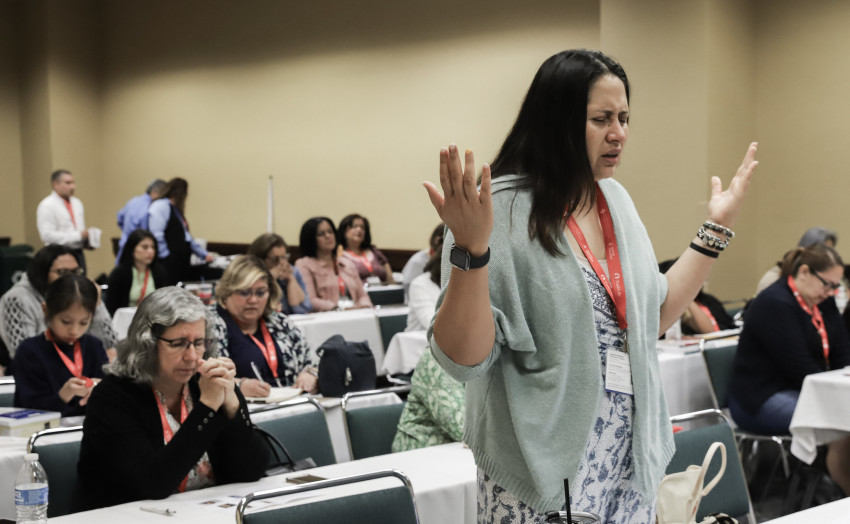 Marcela Chaparro, of Rocky Creek Baptist Church in Greenville, South Carolina, prays and worships during the Hispanic Women’s Ministry Workshop held June 10, 2024, at the Indiana Convention Center in Indianapolis.