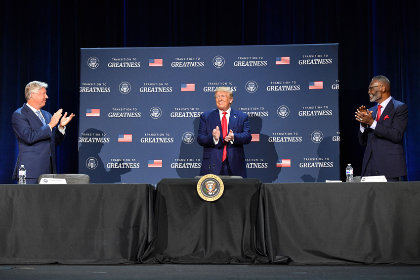 U.S. President Donald Trump (C), flanked by Bishop Harry Jackson (R, now deceased) and Pastor Robert Morris, hosts a roundtable with faith leaders, law enforcement officials, and small business owners at Gateway Church Dallas Campus in Dallas, Texas, on June 11, 2020.