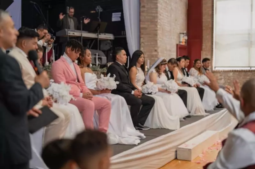 Seven immigrant couples participate in a collective wedding ceremony hosted by New Life Community Church's La Villita Church in Chicago, Illinois.