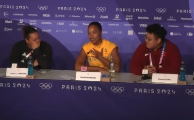 Nigerian-born German athlete Yemisi Ogunleye (middle) speaks during a press conference in Paris, France, after winning the gold medal in women's shot put in Aug. 9, 2024.