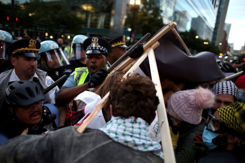 Police clash with demonstrators during a protest at the Israeli consulate during the Democratic National Convention on Aug. 20, 2024 in Chicago, Illinois. Protesters are rallying in Chicago while the DNC is in session August 19-22.