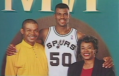 San Antonio Spurs Hall of Famer David Robinson (C) and his father, Ambrose Robinson (L) and mother, Freda Robinson (R) appear on this partial screenshot of the cover of the 1996 book written by his parents, "How to Raise An MVP."