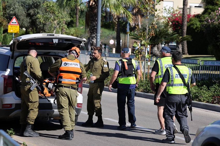 Members of the Israeli security forces walk along a street leading to Prime Minister Benjamin Netanyahu's residence in Caesarea on Oct. 19, 2024. Netanyahu's office said a drone was launched toward his residence on Oct. 19, after the military reported a drone from Lebanon had 