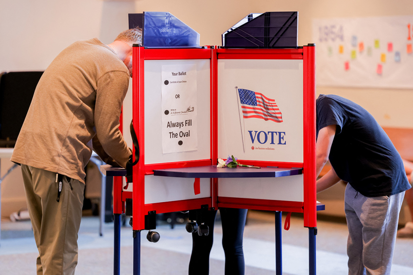 Voters cast their ballots in individual booths at a polling location in Fairfax on Nov. 5, 2024. Americans vote in the presidential election between Democratic candidate Kamala Harris and Republican candidate Donald Trump.