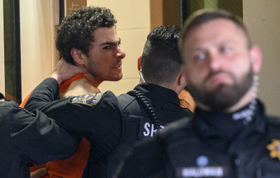 Suspected shooter Luigi Mangione is led into the Blair County Courthouse for an extradition hearing Dec. 10, 2024, in Hollidaysburg, Pennsylvania. Mangione has been arraigned on weapons and false identification charges related to the fatal shooting of United Healthcare CEO Brian Thompson in New York City. Mangione is incarcerated in the State Correctional Institution in Huntingdon, Pennsylvania, awaiting extradition to New York.