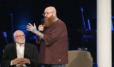 Todd Bentley details what he described as a near death experience he had during a medical emergency last November while speaking at a New Years Eve service at MorningStar Ministries in Fort Mill, South Carolina, as founder Rick Joyner listens intently on Dec. 31, 2024.