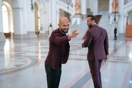 Andrew Tate (left) poses for a photo next to his brother Tristan Tate while entering the Court of Appeal on October 15, 2024 in Bucharest, Romania. Social Media Influencer Andrew Tate and his brother Tristan are appearing in court to appeal a decision to proceed with their trial on charges of rape, human trafficking and forming a criminal gang to exploit women. The Tate brothers were arrested on December 29, 2022, alongside Georgiana Naghel and Luana Radu as part of an investigation into human trafficking and rape.