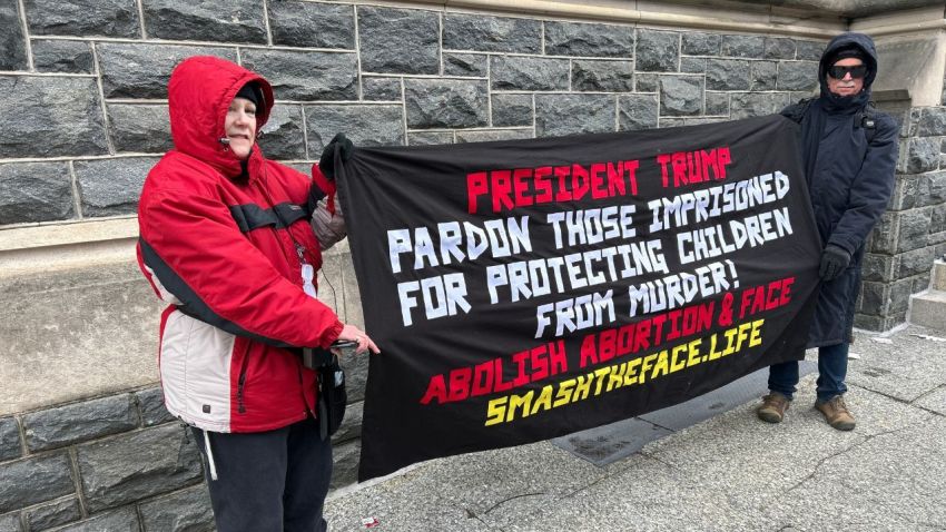 A pro-life advocate named Judy (R) stands outside of the Capital One Arena in Washington, D.C., on Inauguration Day.