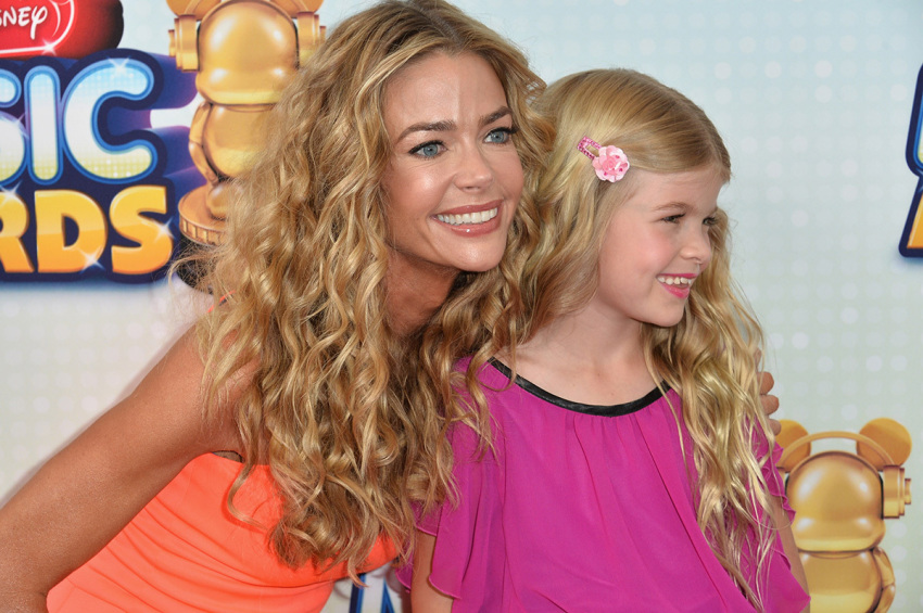 Actress Deinse Richards and daughter Lola Sheen arrive to the 2013 Radio Disney Music Awards at Nokia Theatre L.A. Live on April 27, 2013, in Los Angeles, California.