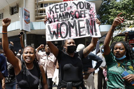 Activists chant slogans and hold placards as they take part in a march against femicide and gender-based violence in Nairobi, Kenya, on Dec. 10, 2024. Kenyan police allegedly tear gassed a peaceful march against femicide in the capital Nairobi, detaining a number of protesters even as more streamed onto the streets in support.
