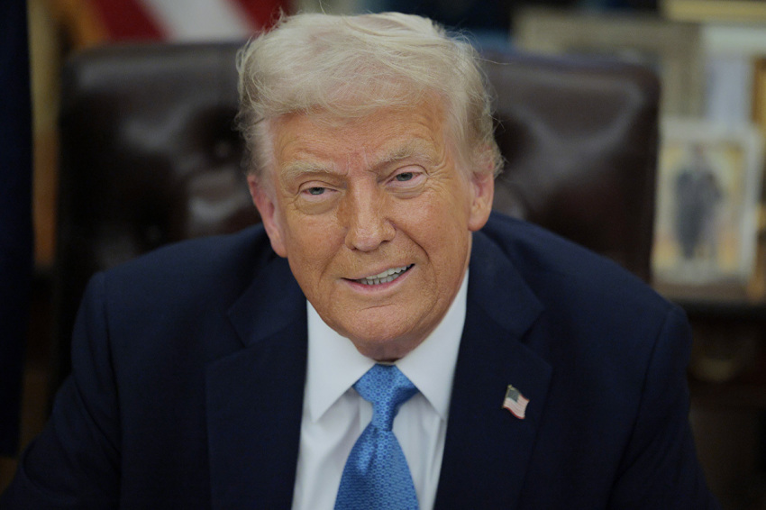 President Donald Trump talks to reporters after signing an executive order, "Unleashing prosperity through deregulation," in the Oval Office on Jan. 31, 2025, in Washington, D.C. Trump spoke to reporters about tariffs against China, Canada and Mexico and how the newly confirmed Interior Secretary Doug Burghum will coordinate with the Energy Department and the Environmental Protection Agency. 