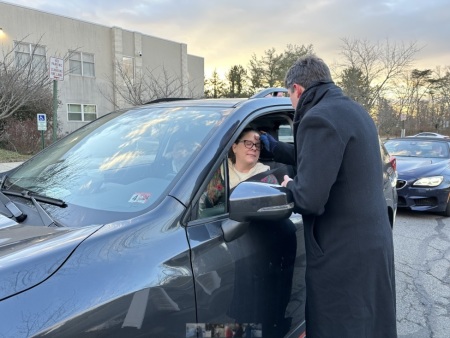 A driver receives an ash cross on her forehead as part of Centreville United Methodist Church of Centreville, Virginia's drive-thru ashes event on Ash Wednesday, Feb. 14, 2024.