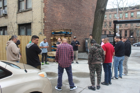 Students and staff at the Brooklyn Adult & Teen Challenge pray outside the historic building housing the faith-based addiction recovery program at 416 Clinton Avenue in Brooklyn, N.Y. on Friday April 4, 2025.