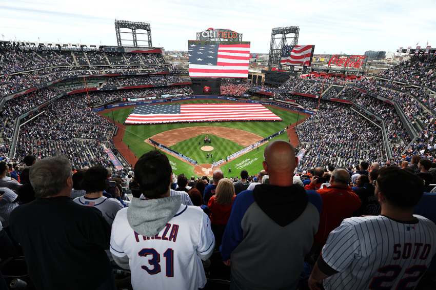 Fans stand for the National Anthem during Opening Day at Citi Field at the game between the New York Metsand the Toronto Blue Jays on April 04, 2025, in New York City.