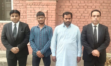 Dawood William (2nd from left) and Shahid Aftab (3rd from left) with attorneys after they were acquitted on April 18, 2025.